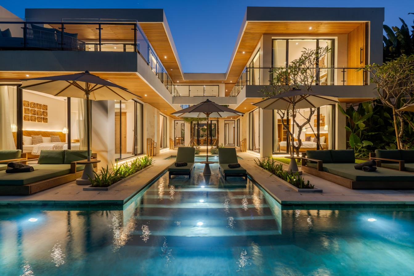 Villa Beroga and its lit pool at dusk